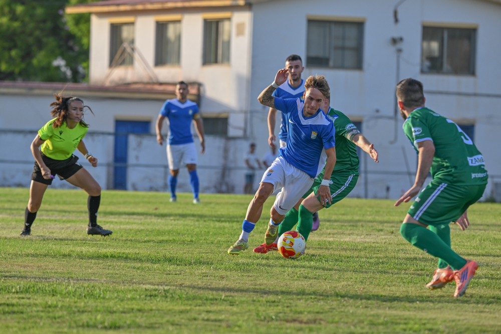 A Xerez CD player runs with the ball against Jerez Industrial at the Pedro Garrido Trophy